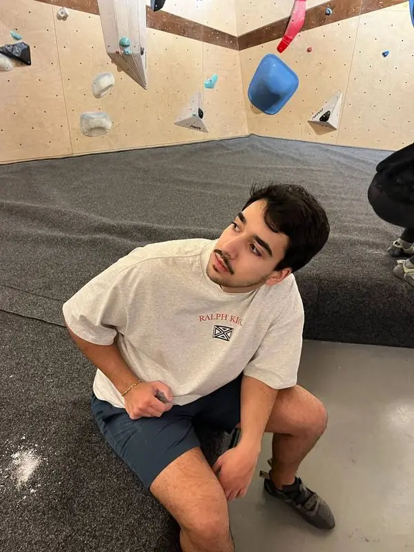 Wearing a RalphKick tee in a bouldering gym
